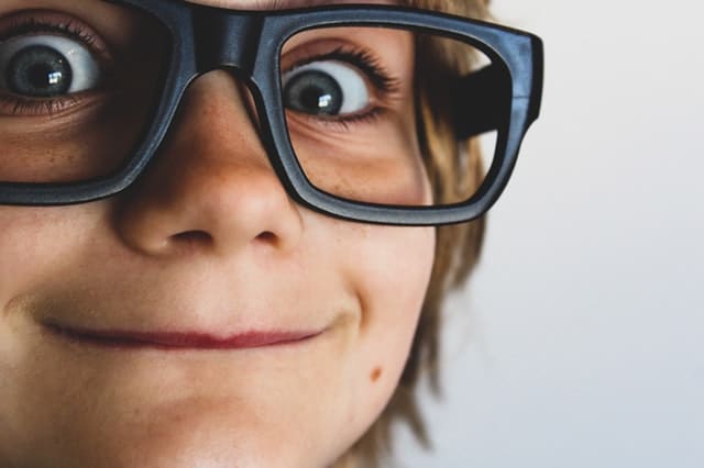 kid wearing glasses 