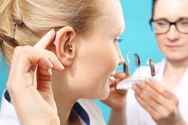 woman wearing a hearing aid