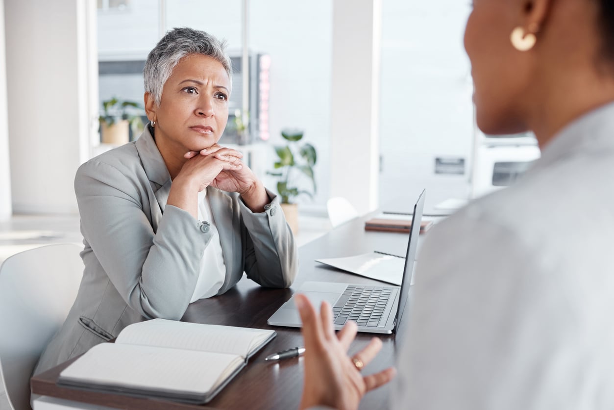 Woman listening to her doctor.